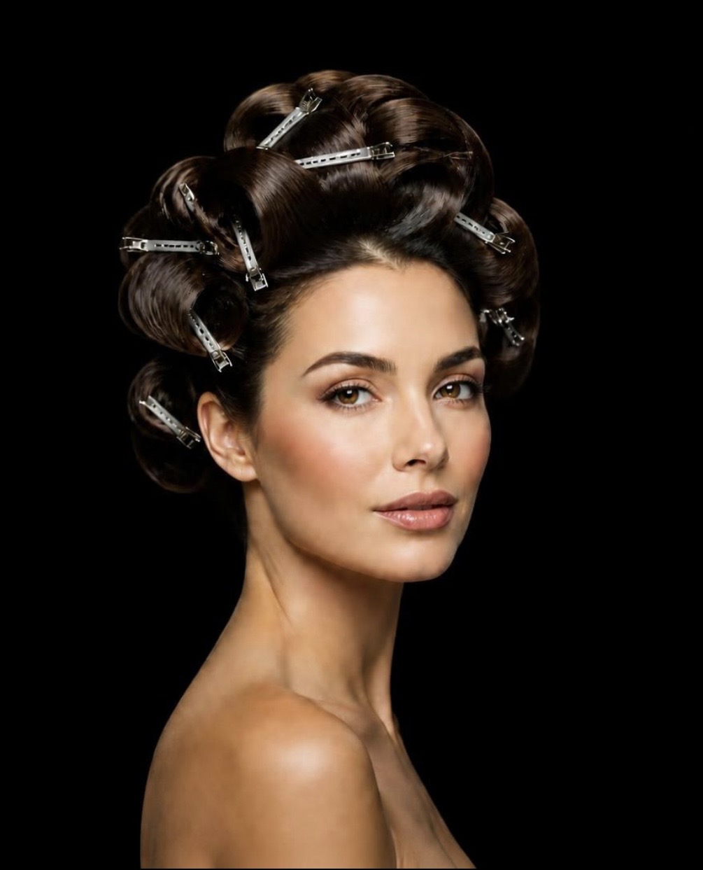 Model with dark hair pin-curled and secured with silver clips at the crown